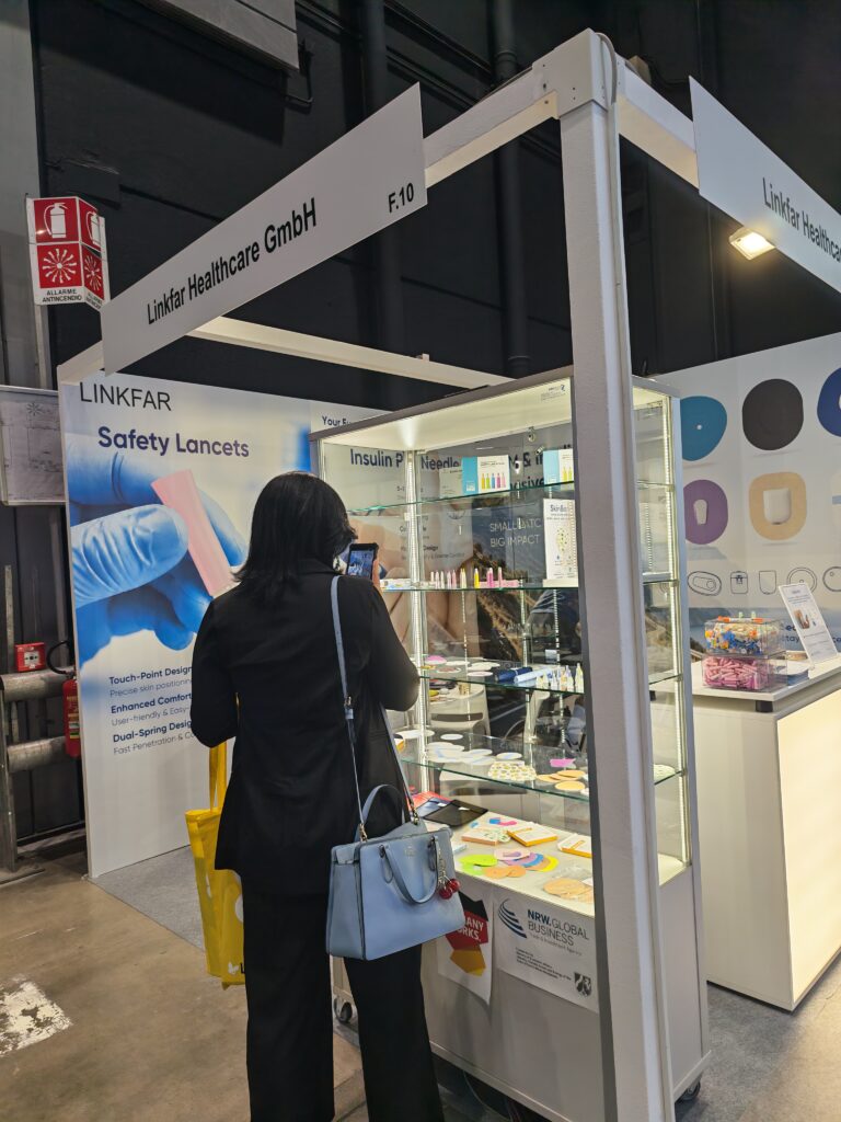 LINKFAR Healthcare GmbH booth F.10 at EASD, showing diabetes-care accessories and medical-device displays.